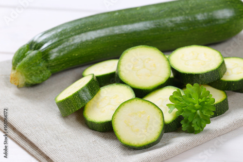 whole and sliced green zucchini