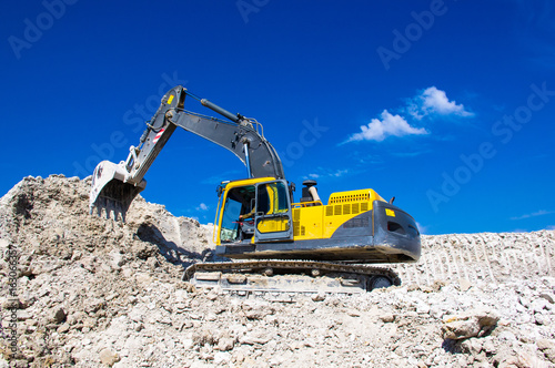 the excavator digging clay