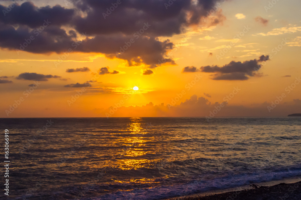 Amazing sea sunset, the sun, waves, clouds