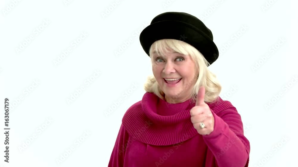 Elderly lady showing thumbs up. Woman smiling on white background. Success depends on your mindset. Elderly lady showing thumbs up. Woman smiling on white background. Success depends on your mindset.