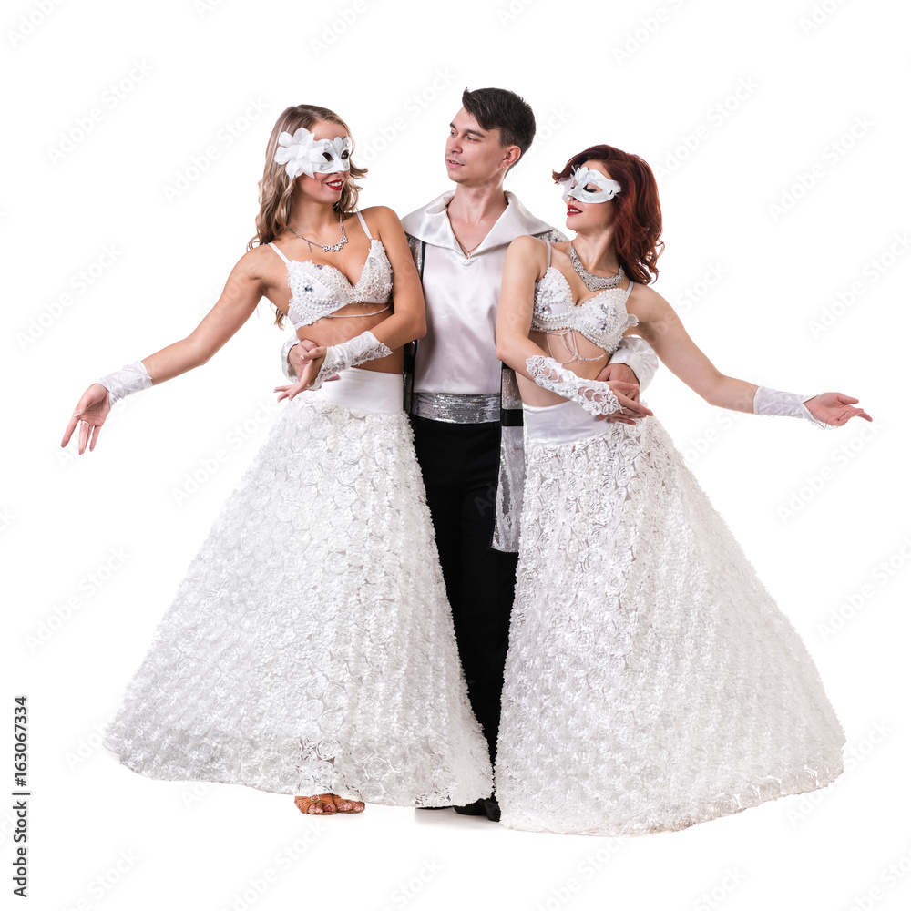 Three carnival dancers wearing a mask dancing, isolated on white