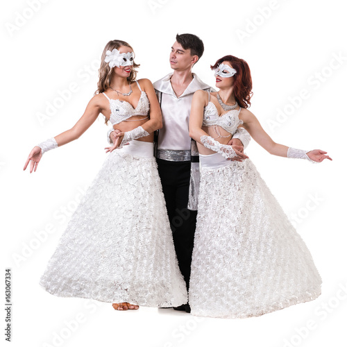 Three carnival dancers wearing a mask dancing  isolated on white