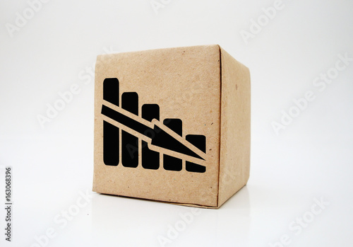 Declining graph. Printed on paper. On a wooden texture.