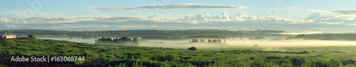 Fototapeta Naklejka Na Ścianę i Meble -  Summer rural landscape with a dawn and a fog