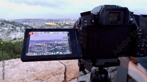 Camera shoots photo timelapse of the Jerusalem Old City view landscape. Mount Scopus is a famous Holy Land place and it has a fantastic view to the Old Jerusalem. photo