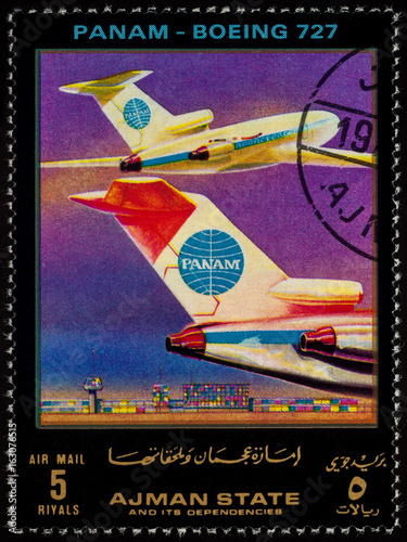 Passenger airliner Boeing 727 on postage stamp photo