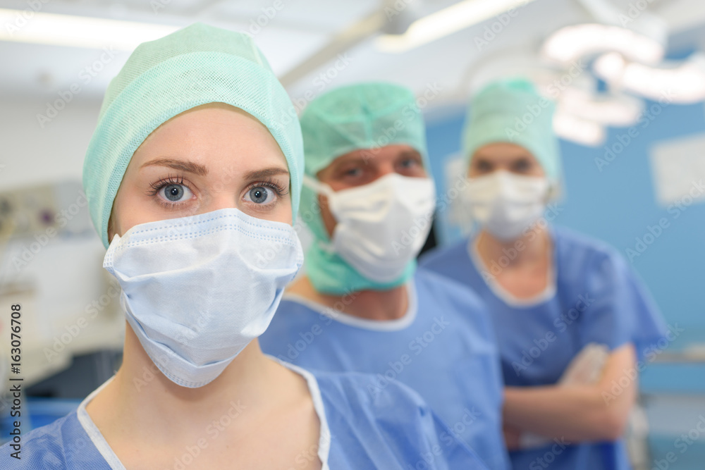 Row in medical staff wearing masks