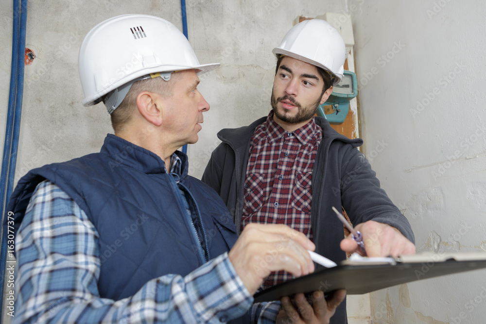 builder and inspector looking at new property