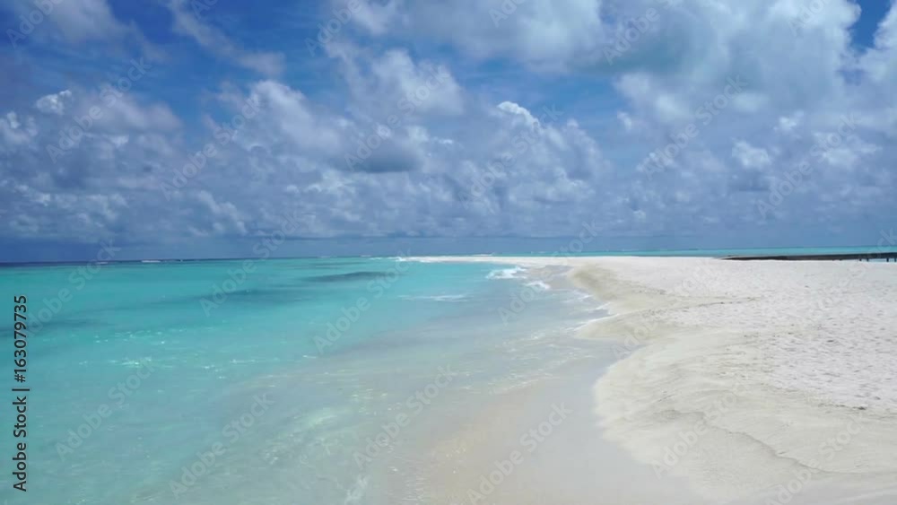 Tropical island beach with blue clear water in the Maldives Tropical island beach with blue clear water in the Maldives