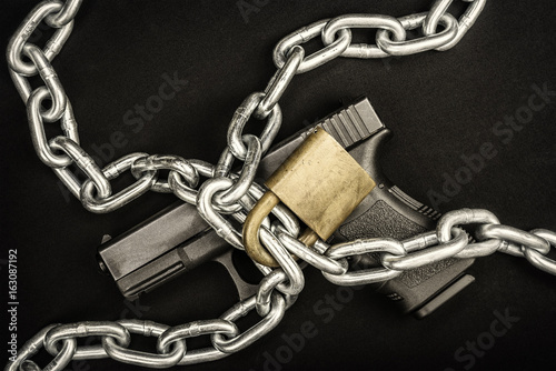 Chained up handgun
