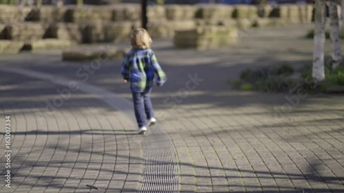 Wallpaper Mural Happy Little Boy Runs On A Line In A Park  Torontodigital.ca