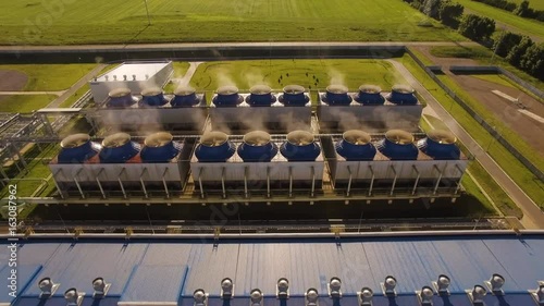 Cooling tower building with pump station at below in power plant. Aerial view