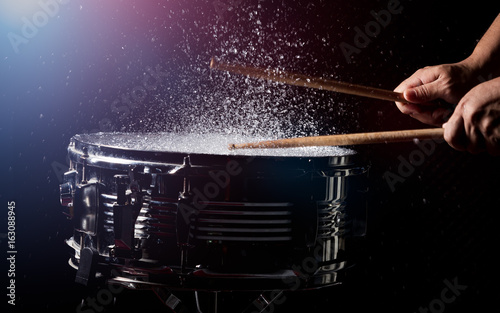 The drum sticks are hitting