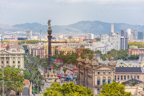 Photography Aerial view over square Portal de la pau, and Port Vell marina and Columbus Monu