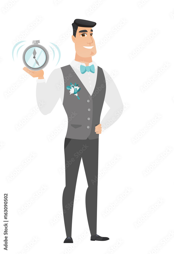 Caucasian groom holding alarm clock. Caucasian groom holding alarm clock.