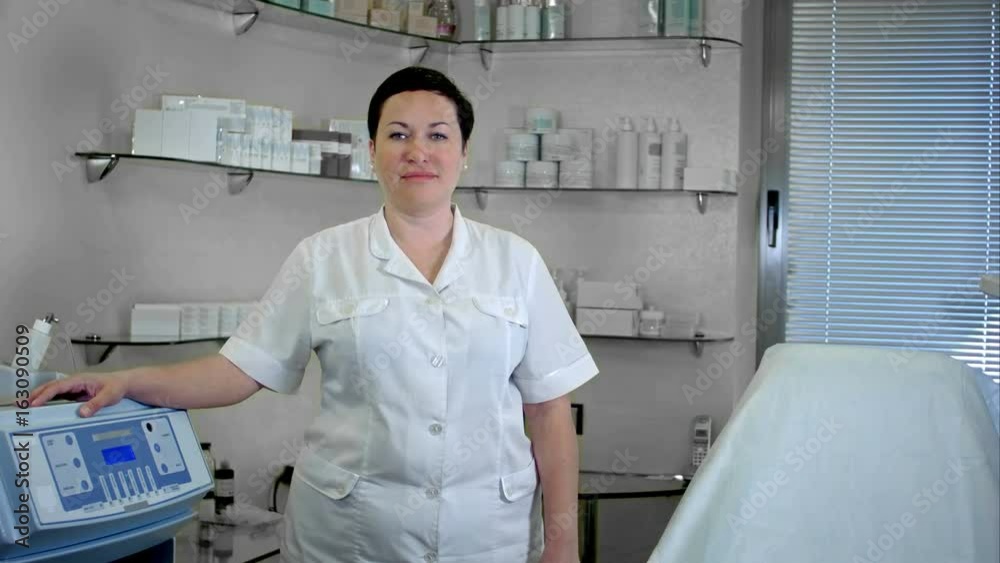 Portrait of confident female doctor standing in lab coat, looking at camera Portrait of confident female doctor standing in lab coat, looking at camera