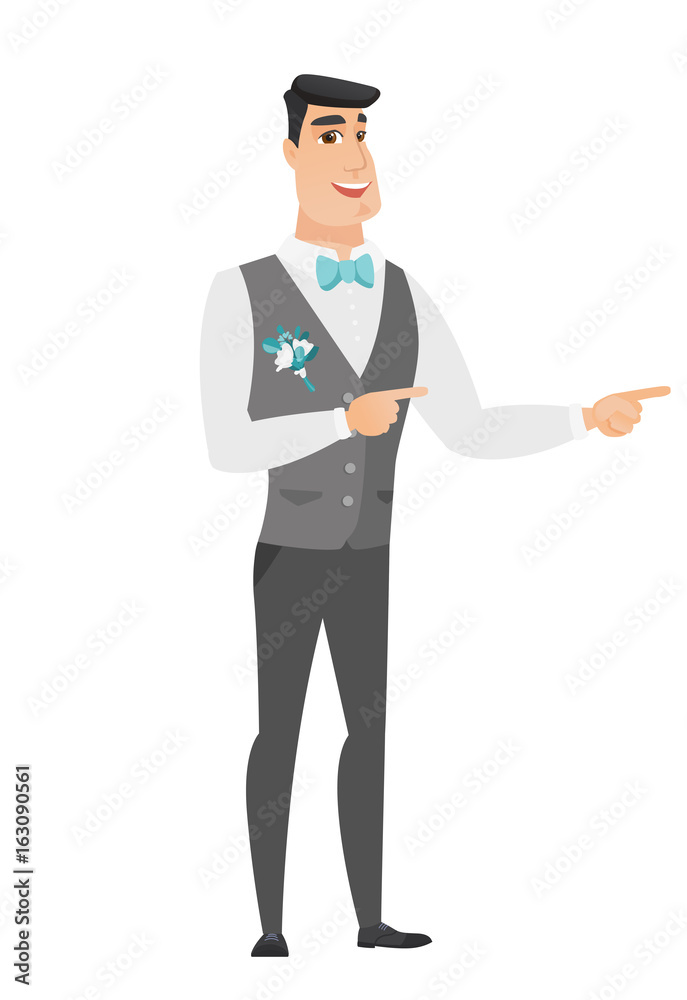 Young caucasian groom pointing to the side. Young caucasian groom pointing to the side.
