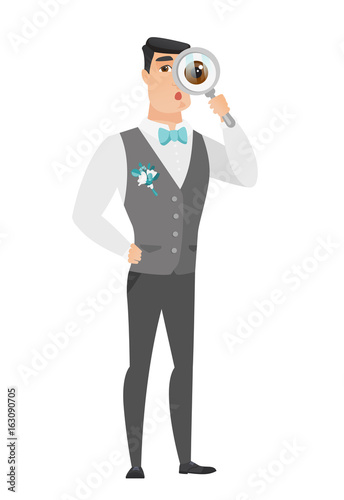 Caucasian groom with magnifying glass.