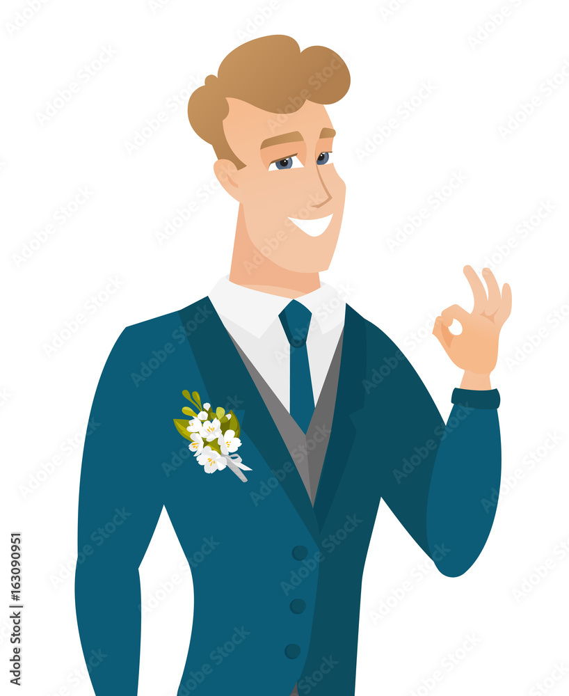 Young caucasian groom showing ok sign.