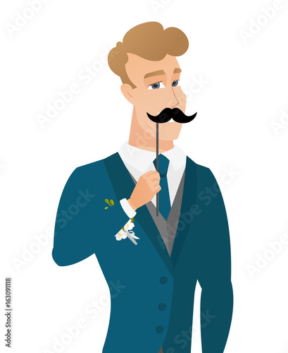 Young caucasian groom with a fake mustache.