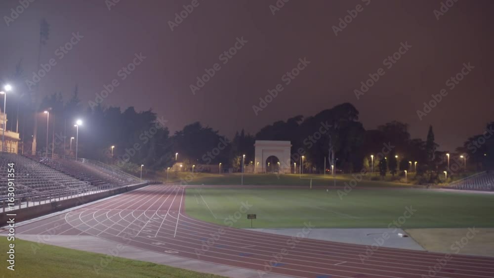 Camera Pans From Left To Right On A Beautiful Empty Track And Field Stadium On A Foggy San Francisco Night Camera Pans From Left To Right On A Beautiful Empty Track And Field Stadium On A Foggy San Francisco Night