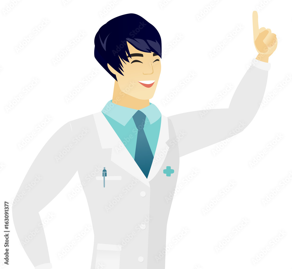 Young asian doctor pointing with his forefinger. Young asian doctor pointing with his forefinger.