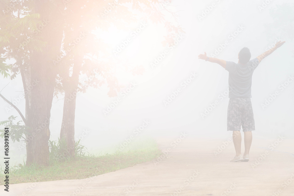 Freedom man stand in the fog forest. Freedom man stand in the fog forest.