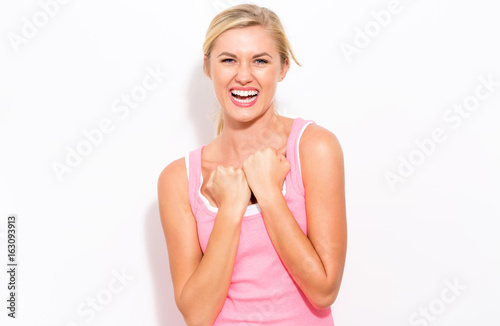 Young woman in a boxing pose on a white background photo