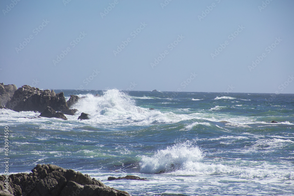 Waves Crash on Rocks  along 17 mile drive Pebble Beach California