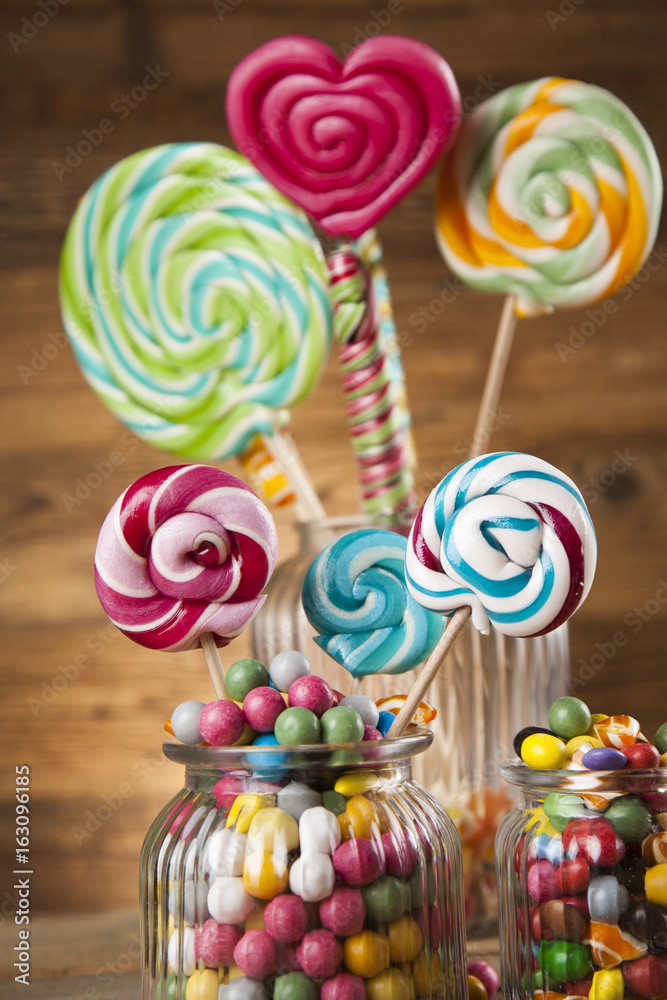 Lollipops and sweet candies of various colors Lollipops and sweet candies of various colors