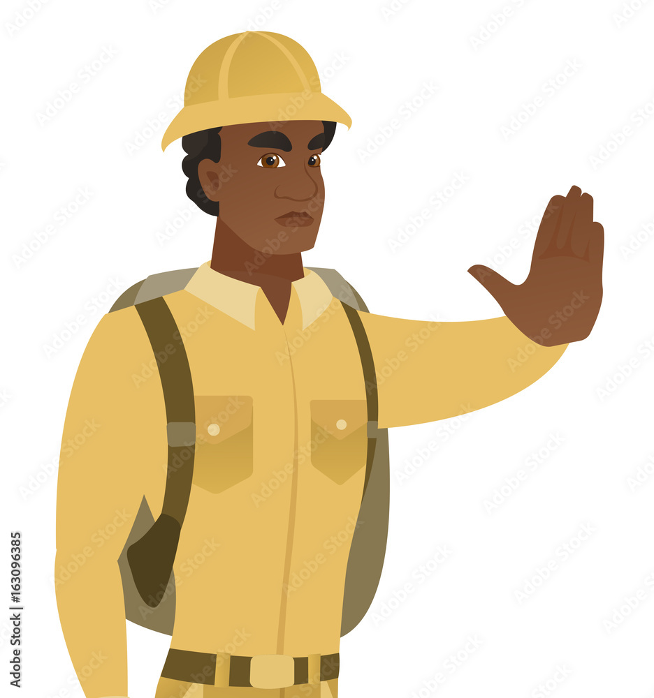 African traveler showing stop hand gesture.