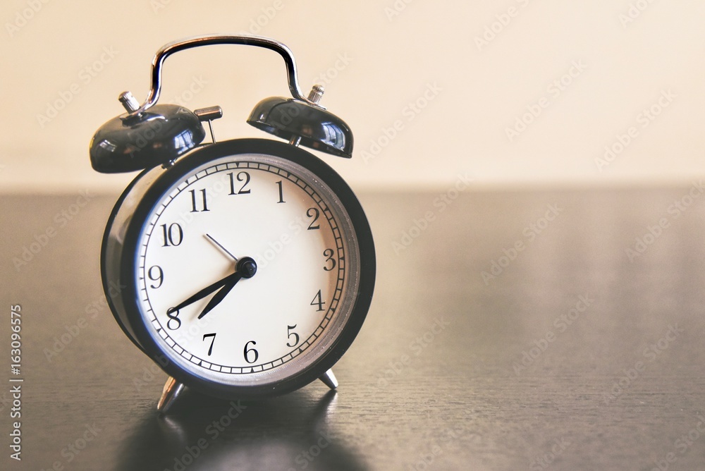 Minute Hand Almost Ticking to Eight O'clock on a Morning Alarm Clock Minute Hand Almost Ticking to Eight O'clock on a Morning Alarm Clock