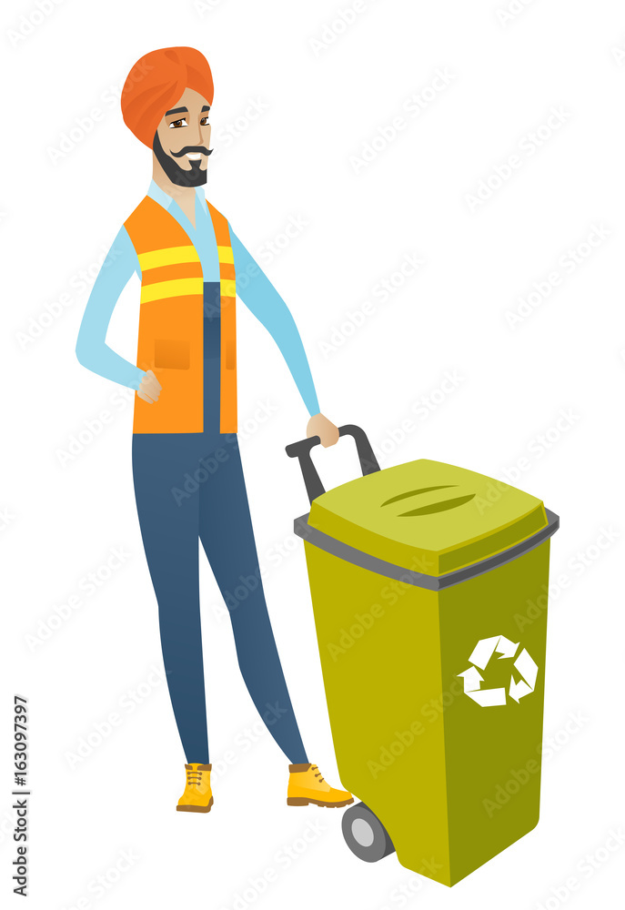 Young hindu builder pushing recycle bin. Young hindu builder pushing recycle bin.