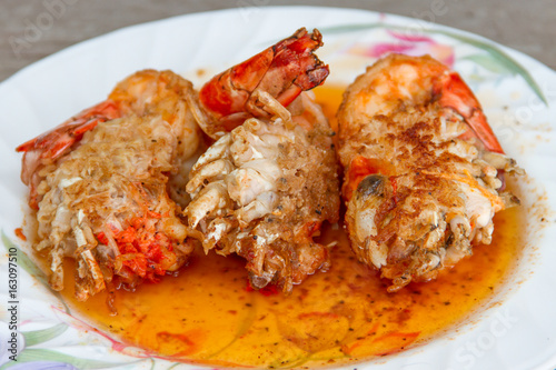 Fried shrimp with salt on pan