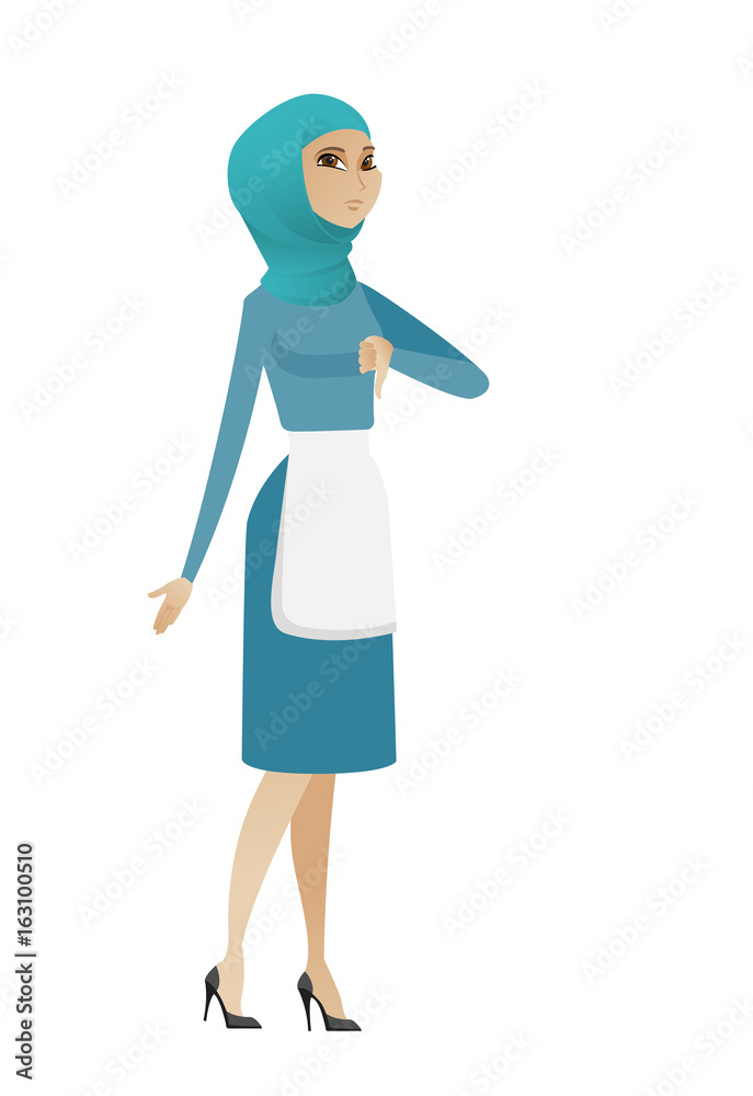 Disappointed young muslim cleaner with thumb down. Disappointed young muslim cleaner with thumb down.
