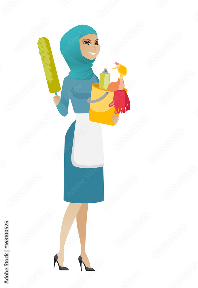 Cleaner holding bucket full of cleaning equipment. Cleaner holding bucket full of cleaning equipment.