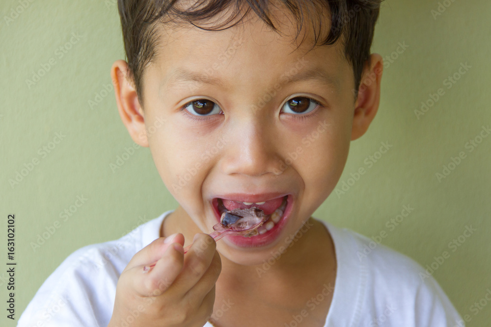 A boy eating ice cream
