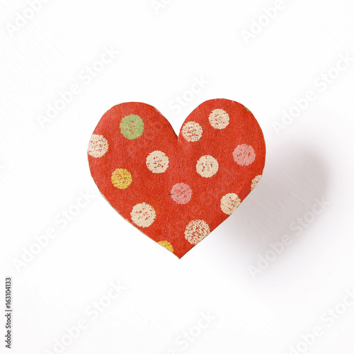 Heart shaped paper on white background