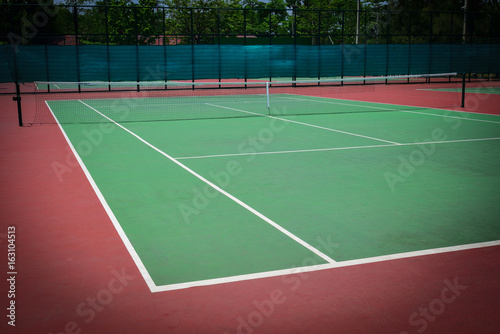 green tennis court © sutichak