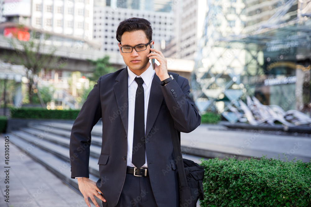 Young asian businessman outdoors Young asian businessman outdoors