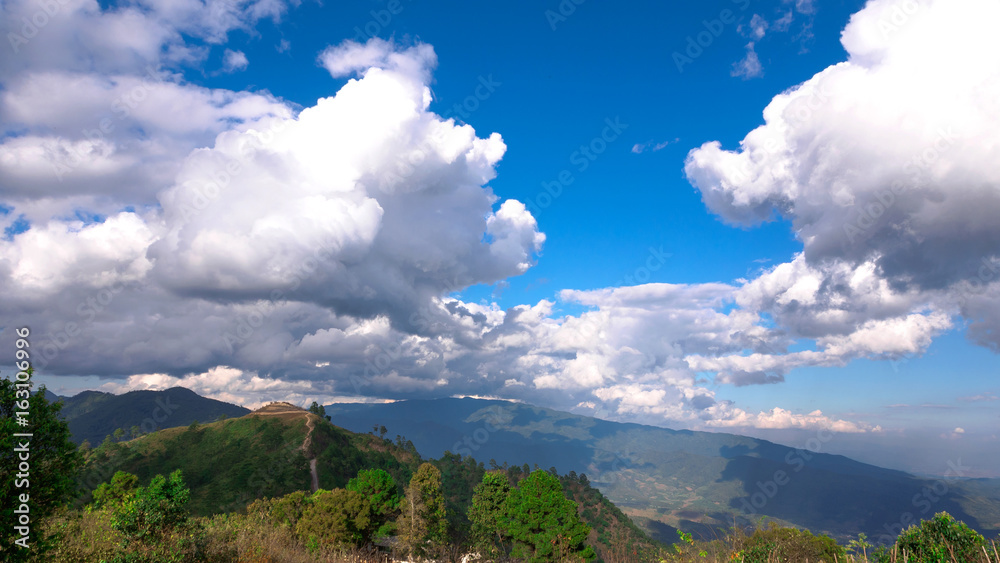 Landscape view of green mountains and blue sky with clouds at Thailand
