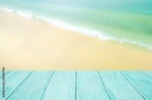 Wooden floor with blurred landscape nature view of beach in the background