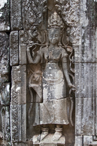 showing dancing Hindu goddesses at Bayon temple, Cambodia.
