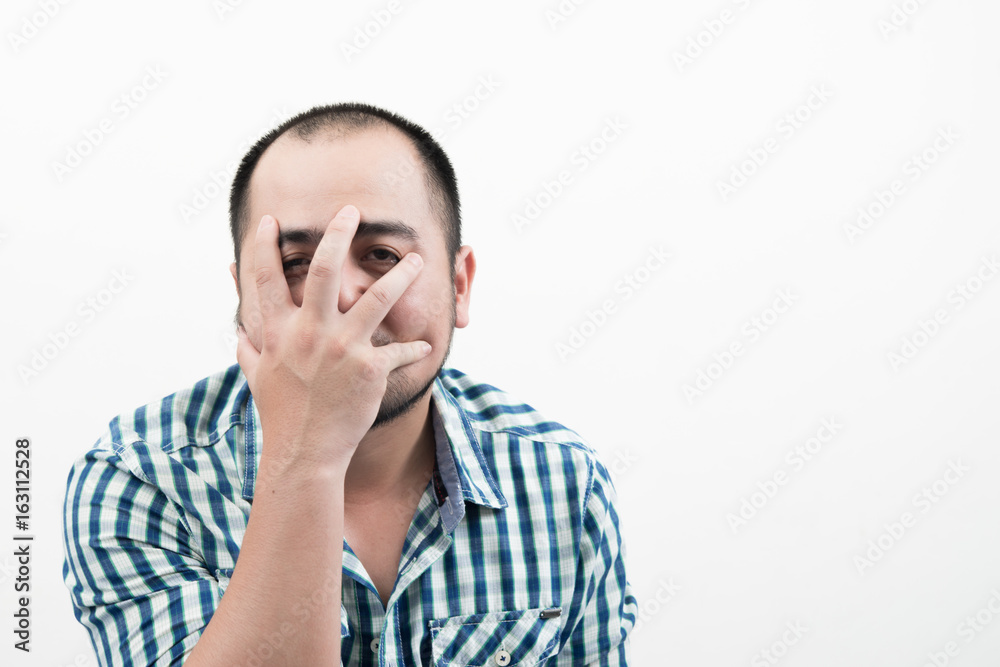 Man covering his face isolated on white background. Man covering his face isolated on white background.
