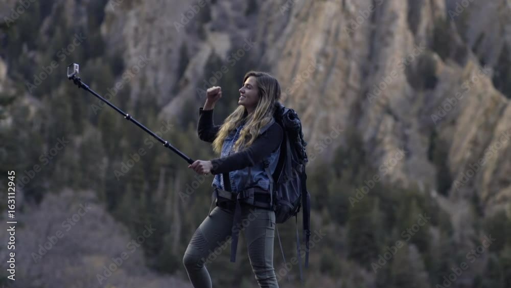 Adventurous Young Woman, On Solo Backpacking Trip, Poses For Her GoPro In Utah Mountains Adventurous Young Woman, On Solo Backpacking Trip, Poses For Her GoPro In Utah Mountains