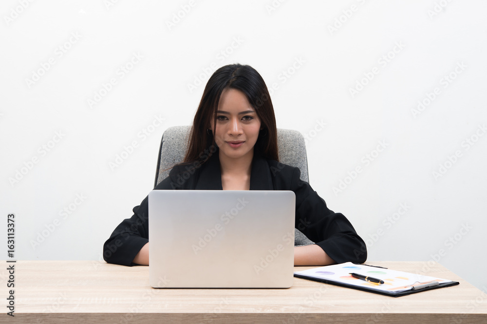 Young asian pretty business woman with notebook in the office isolated on white background. Young asian pretty business woman with notebook in the office isolated on white background.