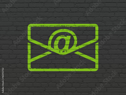 Business concept: Email on wall background