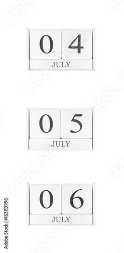 Closeup group of white wooden calendar with black 4 july , 5 july , 6 july word , three date calendar isolated on white background