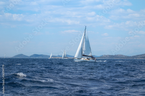 Sailboat under Full Sail at Adriatic Sea near the Island of Murter, Dalmatia, Croatia © t_o_m_o