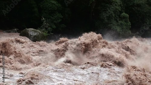 Slow motion shot of Urubamba River in full flood in the Urubamba Valley, Peru photo